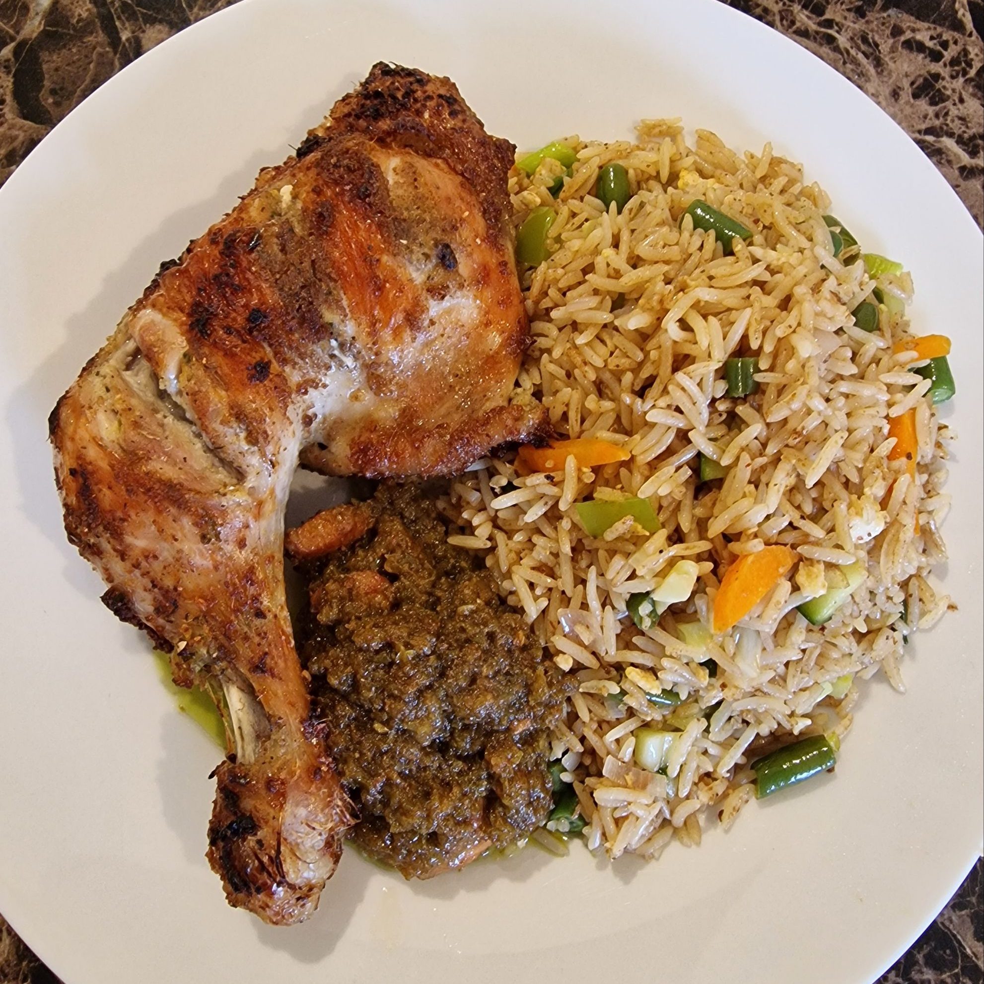 Ghana fried rice with grilled chicken leg